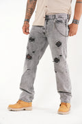 Jeans Gris Rotos con Parche Negro y Cadena Estilo Urbano