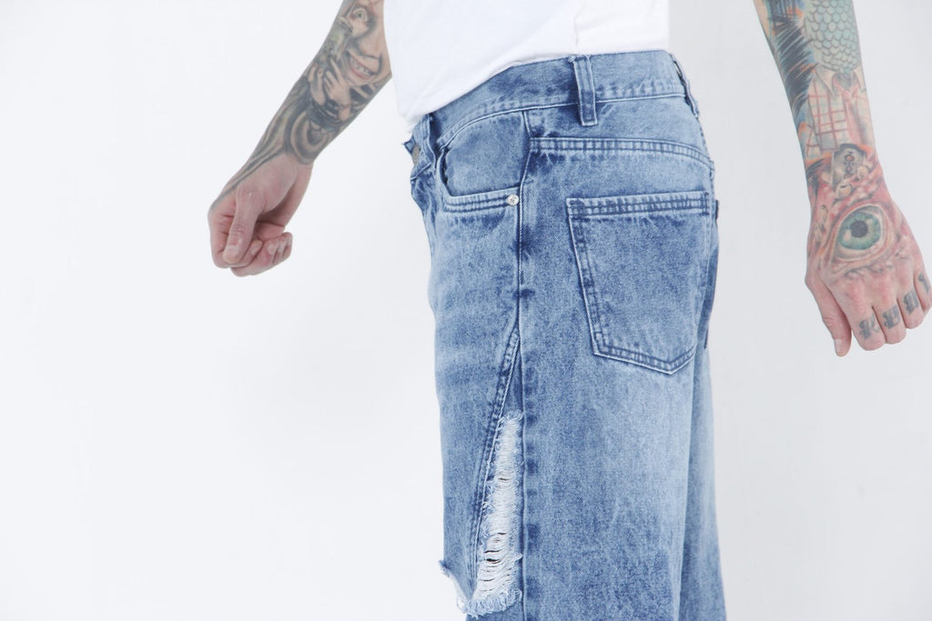Jeans de Mezclilla Azul Deslavado con Roturas Frontales – Straight Fit Streetwear